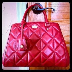 A Coach red leather quilted satchel handbag